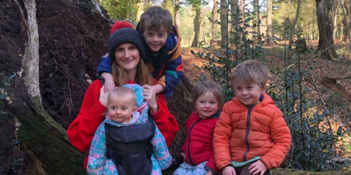 Laura hiking with her children in outdoor clothes